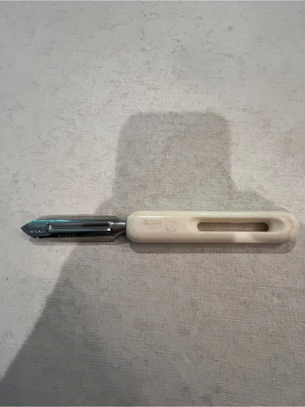 Vintage Bonny white plastic handled parer/ corer tool. GUC!